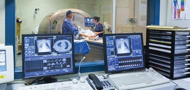 Two hospital workstations displaying imaging results